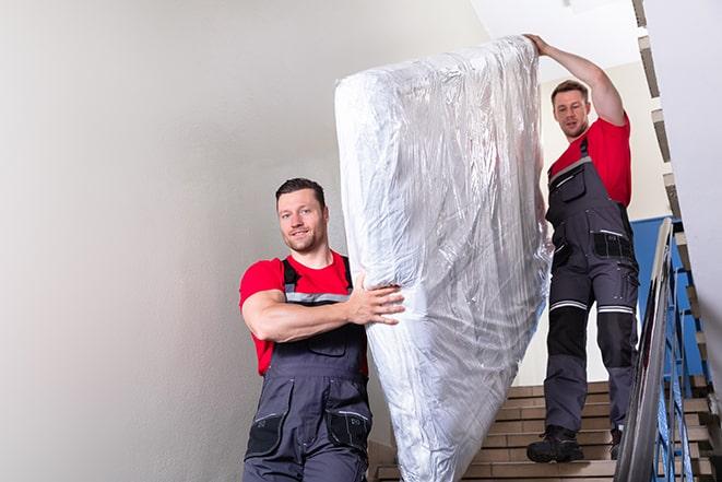 hauling away a worn-out box spring from a home in Chandlersville